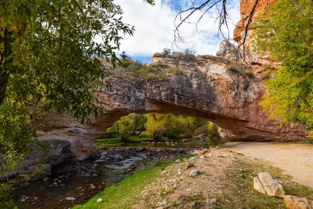A vibrant scene where the Ayres Natural Bridge has a stunning overlook in Douglas, Wyoming.