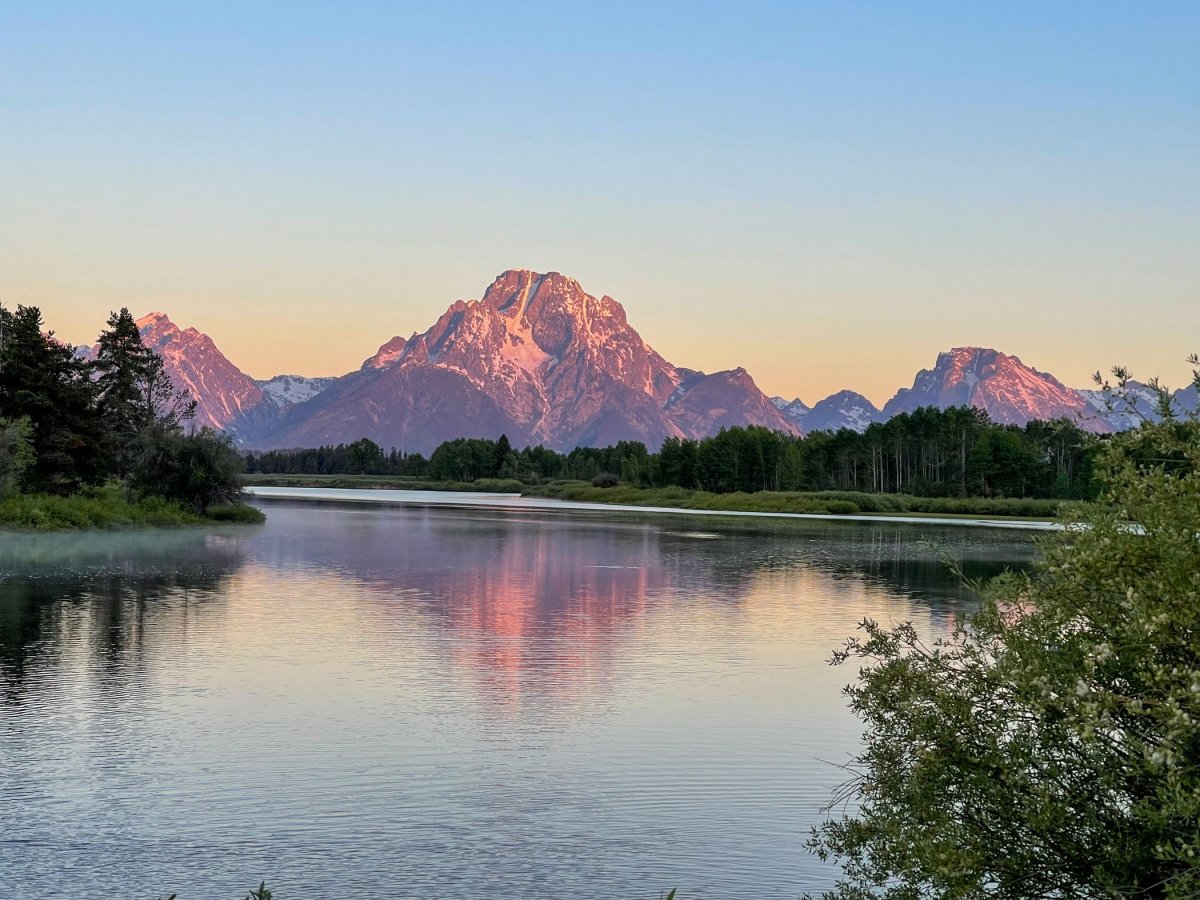 Tetons reflecting in the waters of the Snake River at Oxbow Bend