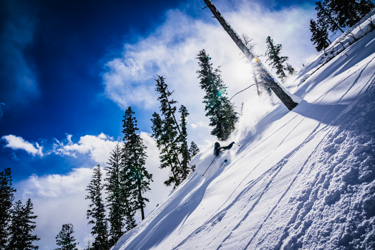 Skier going down a steep mountain in Sleeping Giant Ski Area.