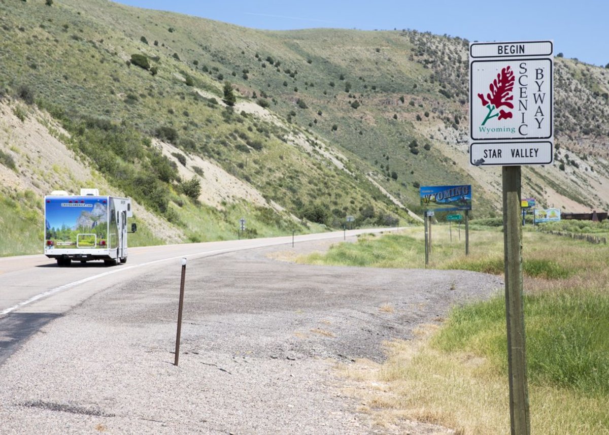 Sign of Scenic Byway with greenery all around in Wyoming