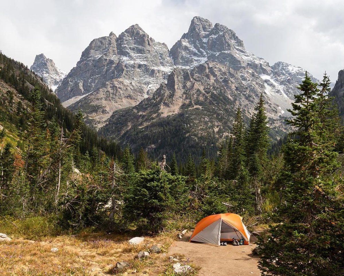 backpacking setup in front of the Teton mountain range in Wyoming 