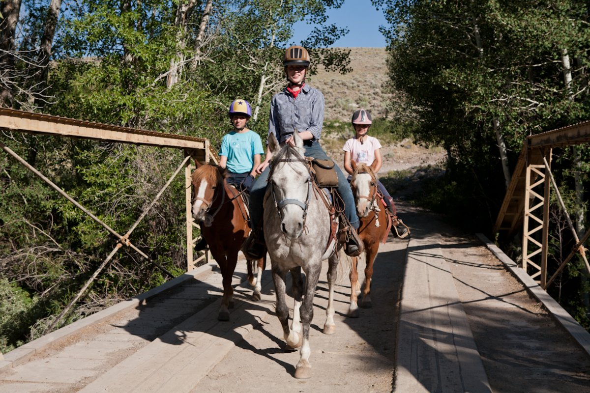 Horseback riding at a dude ranch.