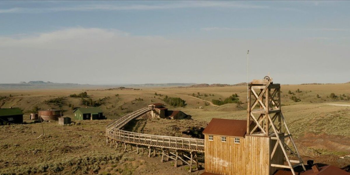 Carissa Mine with mountains and rolling hills in the background.