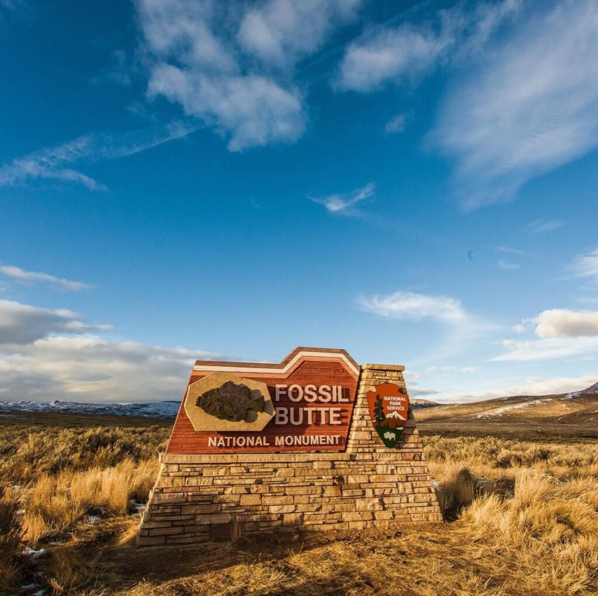 A blue sky with wispy clouds overlooks the Fossil Butte National Monument in Lincoln County, Wyoming.Butt