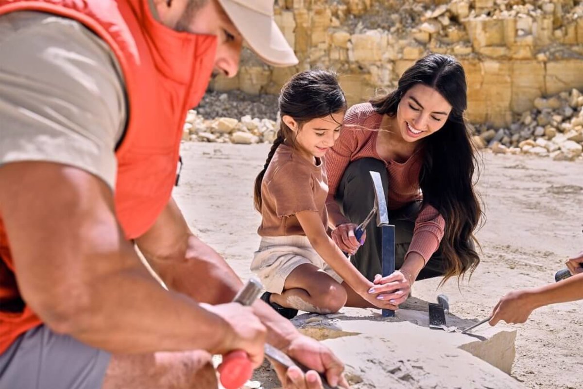 A family digging for fossils at the American Fossil Quarry.