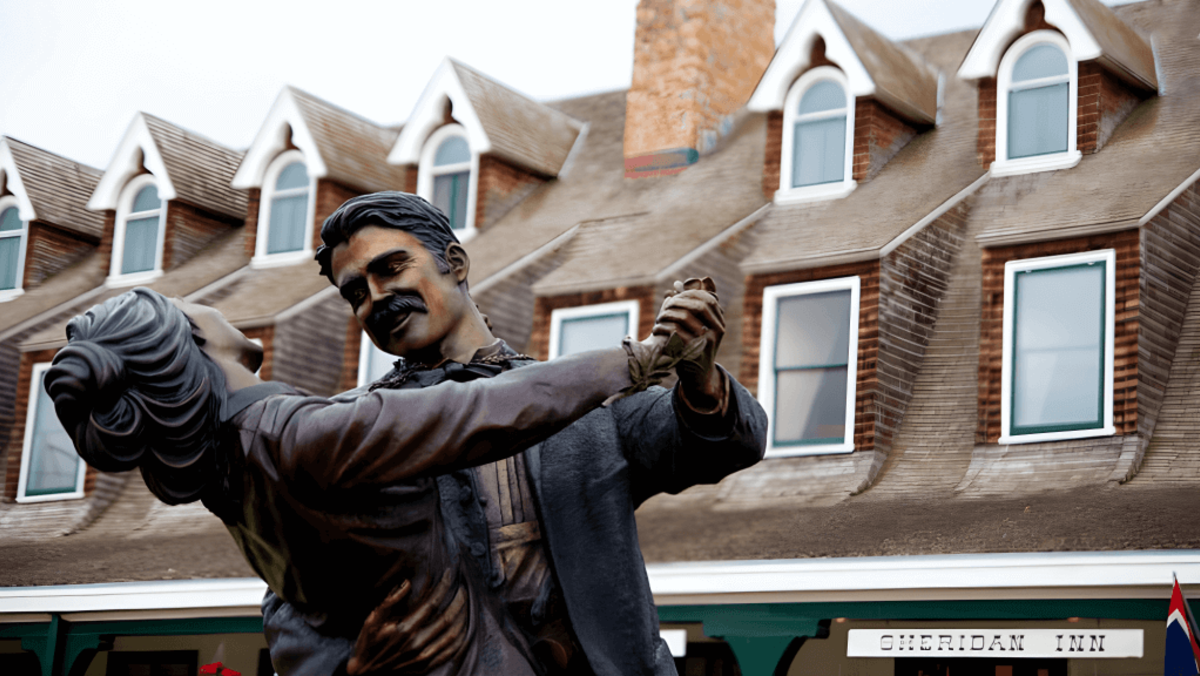Statue dancing in front of The Historic Sheridan Inn, a popular attraction and a thing to do in Sheridan, Wyoming.