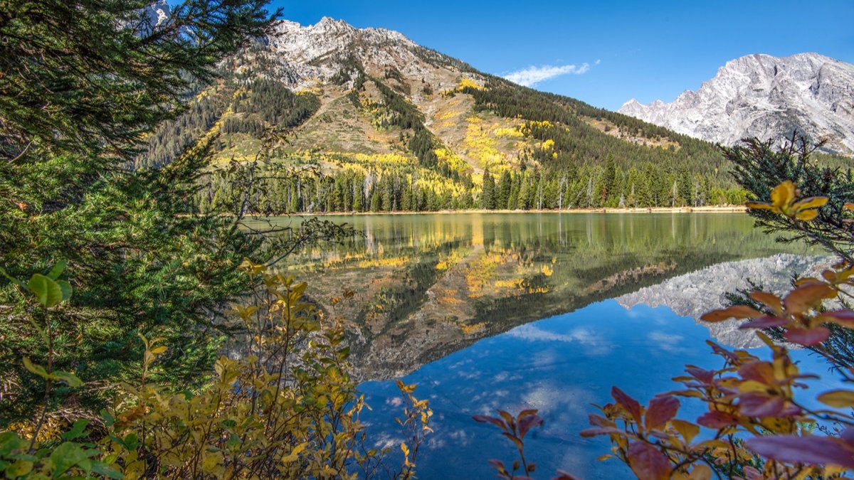 Mountains reflecting in the waters of String Lake