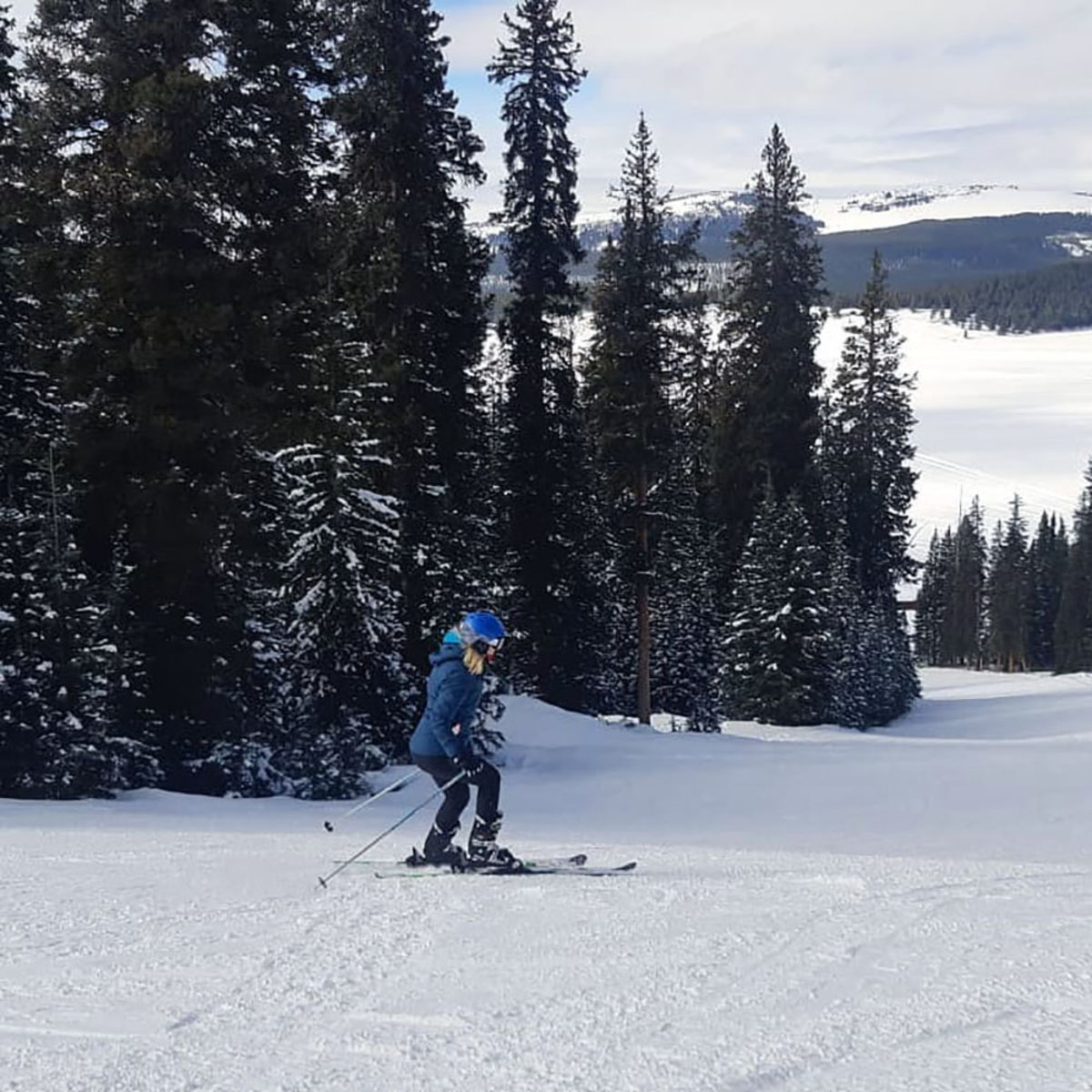 Woman skiing through the Bighorn mountains in Wyoming