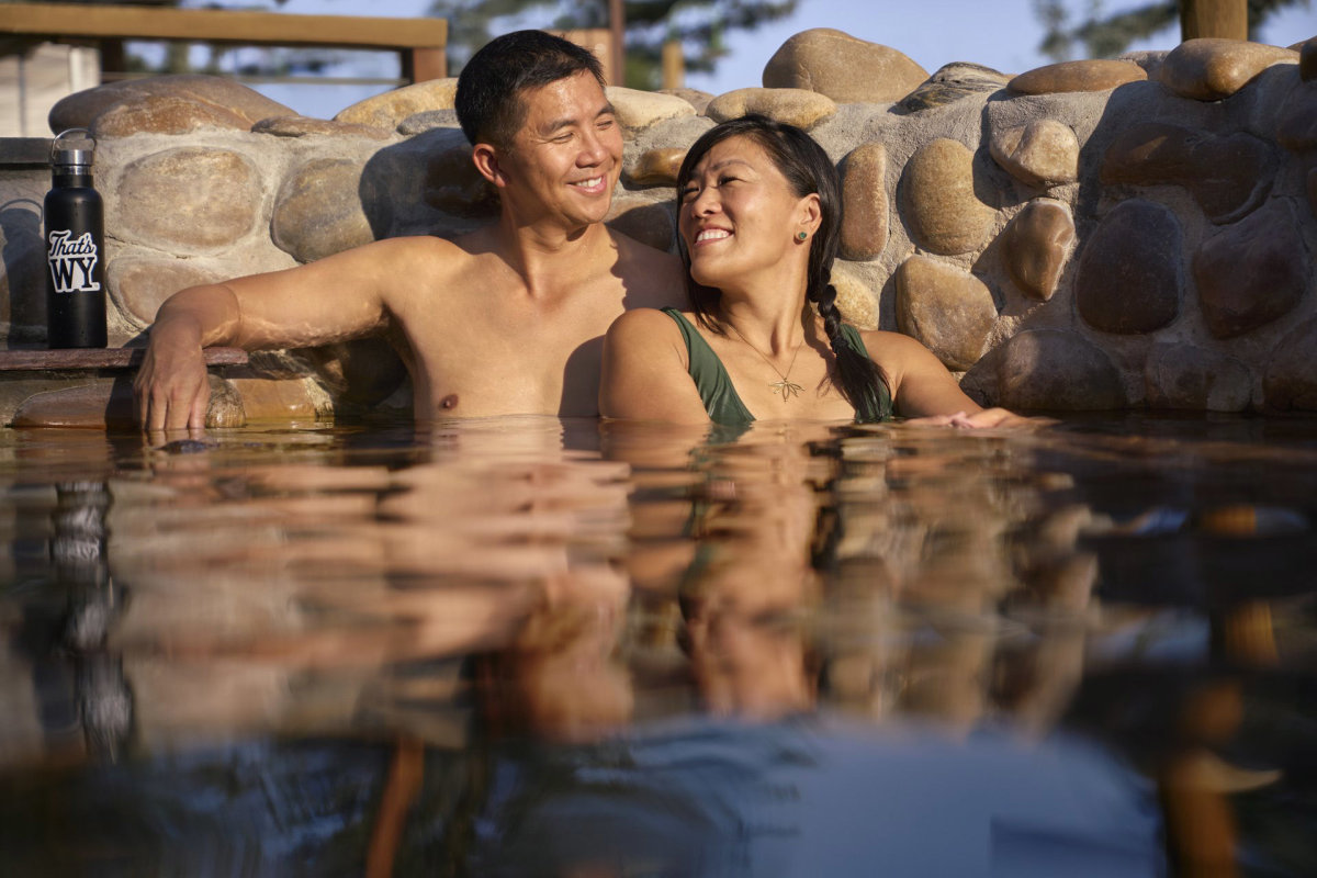 Couple soaking in the hot springs pool in Saratoga.