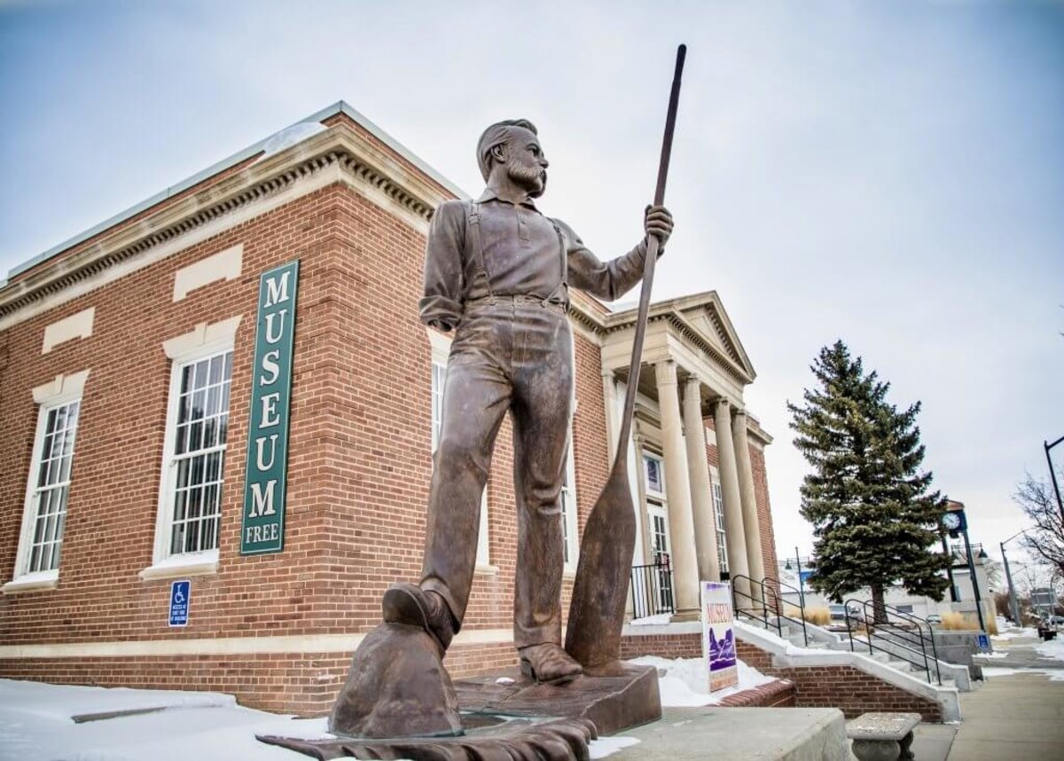 A statue stands before the Sweetwater Museum in Rock Springs, a popular things to do.