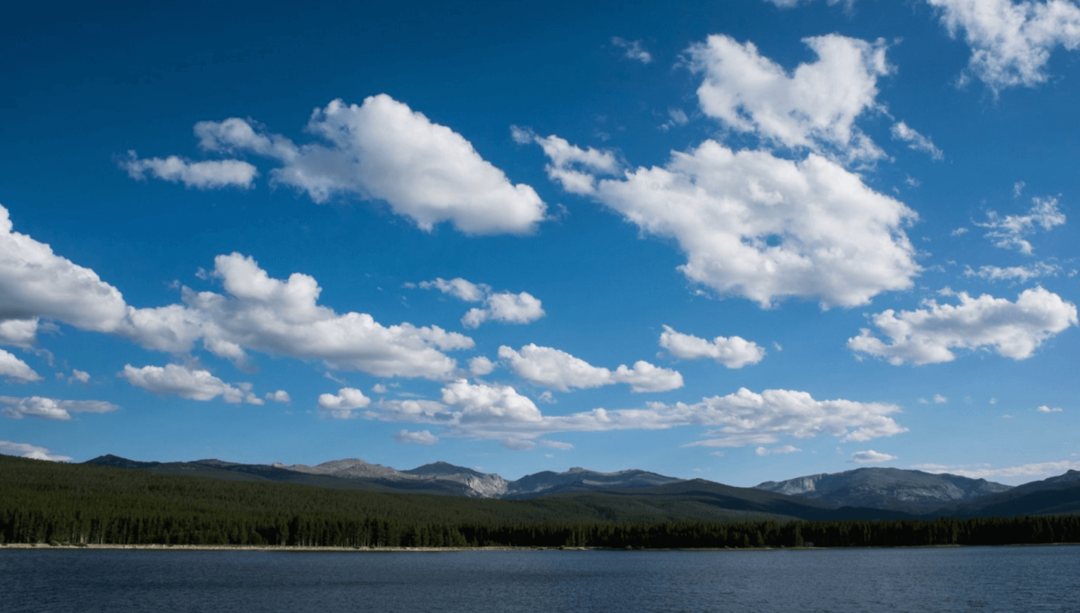 A lake in Wyoming with the mountains towering behind it.