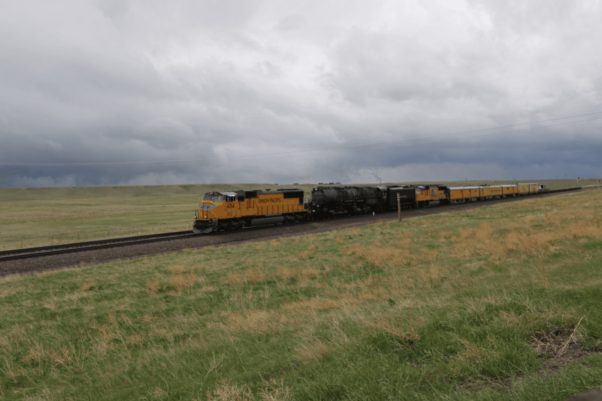 A Union Pacific locomotive traveling via rail in Wyoming.