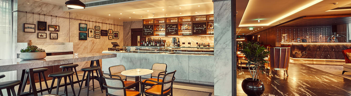 The Sage of Cambridge coffee shop, cafÃ¨ and evening wine bar situated in the lobby area of The Fellows House Cambridge, Curio Collection by Hilton hotel.