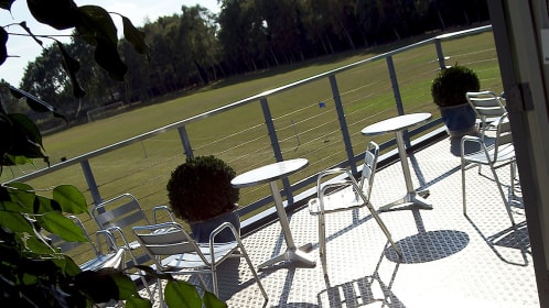 The balcony with a view of the sports field. Perfect for team building activities and summer parties.