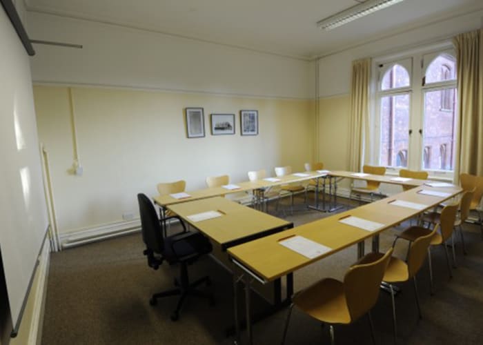 A small conference room that is light and inviting, providing a less formal surrounding for a day meeting.