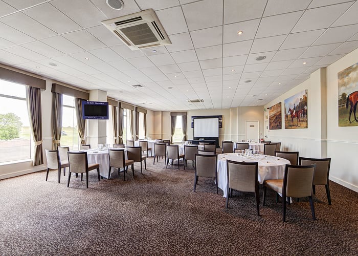 A comfortable stylish conference room filled with natural light and stunning views.