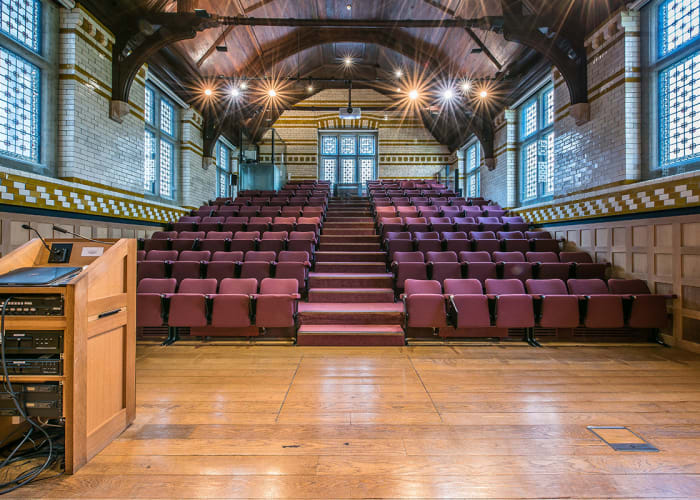 The Bateman Auditorium is the largest of our Old Courts rooms. With a tiered theatre complete with lectern-controlled AV equipment, theatre lighting and sound booth, it is an excellent venue for both conferences and artistic performances. Subject to approval by the Director of Music, it is also possible to hold piano recitals with use of the Steinway Grand Piano.
