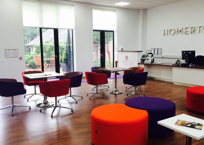 Modern bright reception area with multi coloured chairs and seating