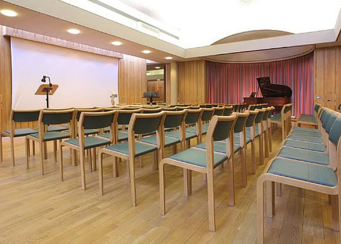 The William Mong Hall, is a large meeting room, set theatre style with a large screen and podium.