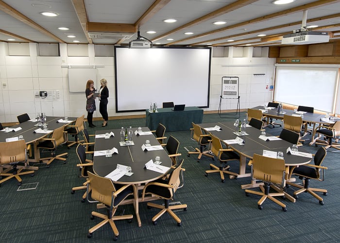 Situated within the Study Centre, this room features views across Churchill College's grounds and has sliding external doors that open out onto a patio area.