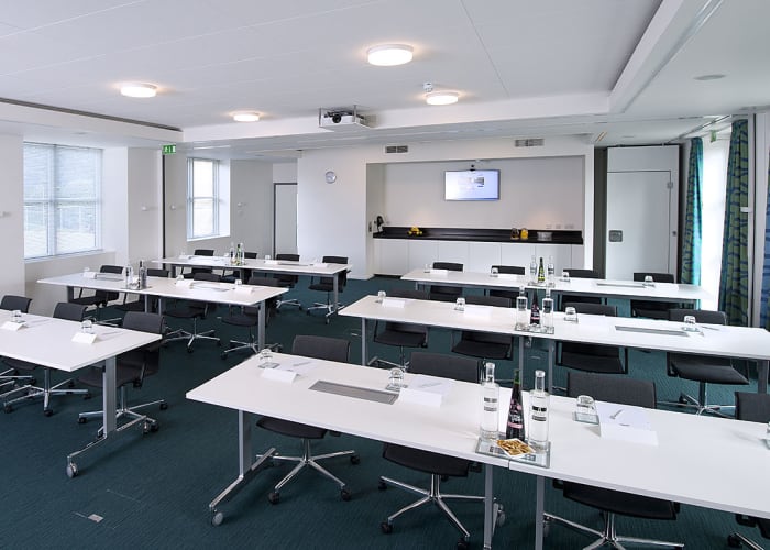 Situated in the Main Building, this new suite features views across Churchill College's grounds and external doors that open out onto a private patio area. The suite can also be divided into two smaller meeting rooms for further flexibility.