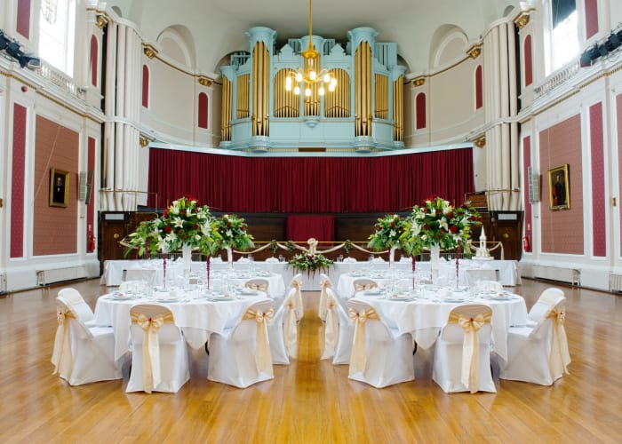 The Large Hall is the main space within the Guildhall. This impressive conference venue is often used for university degree ceremonies. It offers 330 square metres of floor space which can be set up in a variety of configurations depending on the nature of your conference. The space can easily accommodate 40 exhibition stands measuring 1.83 x 0.92 meters.
There is a fixed stage and two dressing rooms to the rear. Lighting and sound equipment can be provided and operated by our team of experienced staff.