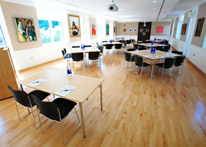 The Long Room is a flexible flat floored space allowing a range of layouts for up to 180 delegates. The room has plenty of natural daylight but it is also fitted with black out blinds, making it suitable for presentations. The room includes an overhead projector, screen, lectern and microphones.