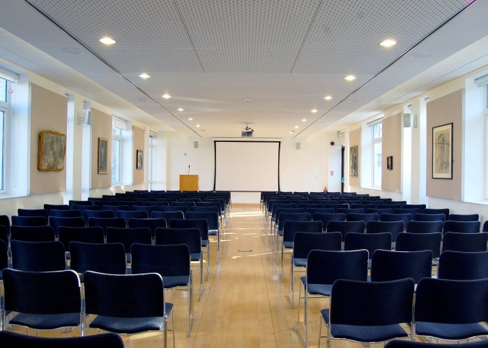 The Long Room is a flexible flat floored space allowing a range of layouts for up to 180 delegates. The room has plenty of natural daylight but it is also fitted with black out blinds, making it suitable for presentations. The room includes an overhead projector, screen, lectern and microphones.