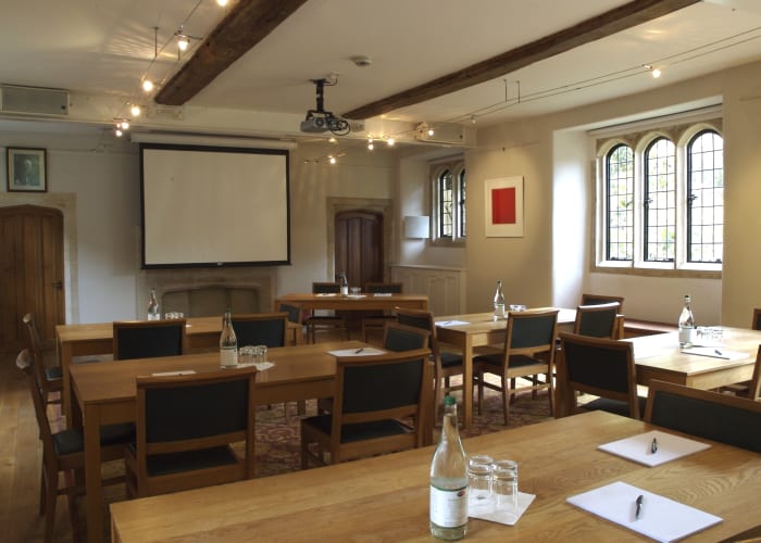 The historic Graham Storey Room overlooks Latham Lawn, and is set for a meeting, with projector, screen and refreshments