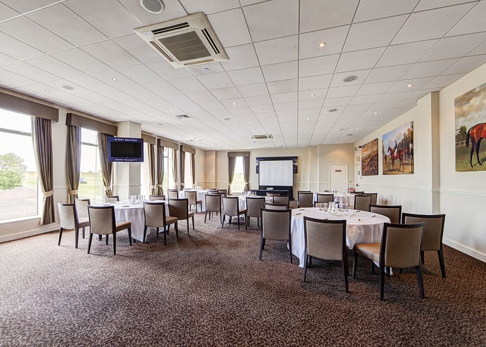 A comfortable stylish conference room filled with natural light and stunning views.
