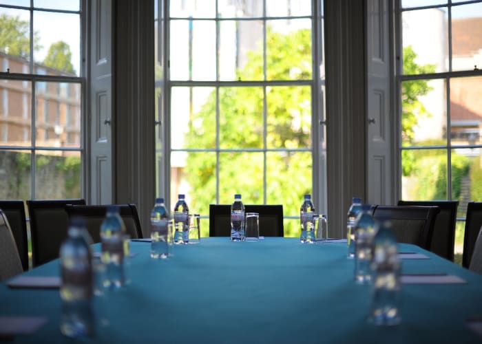 Camden House, a traditional meeting room with windows overlooking the gardens.