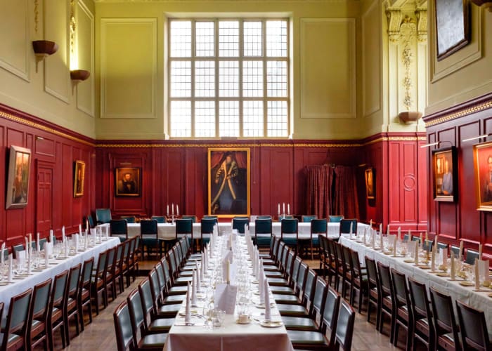 The College Hall is a grand dining space, with the walls are lined now with portraits of past Masters.