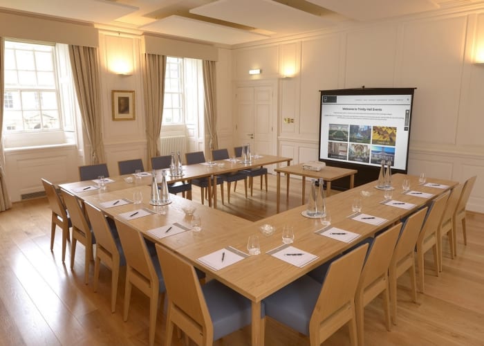 The Leslie Stephen Room set U shape with a screen, is an ideal space for small meetings.