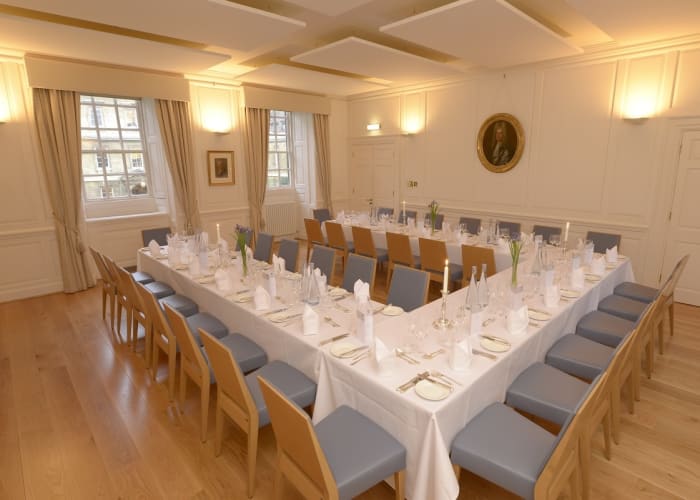 The Leslie Stephen Room, set for dinner with white linen, is the perfect space for private dinners and drinks receptions