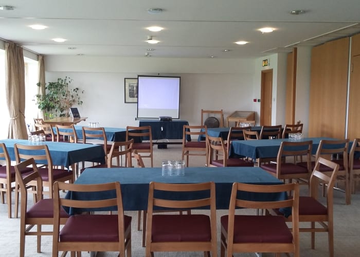 The Peter Richards room, a light room with windows along one wall, suitable for a variety of events.