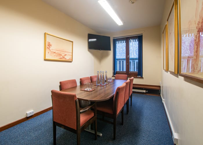 A meeting room at Darwin College set boardroom style with television. Ideal for interviews and small meetings.