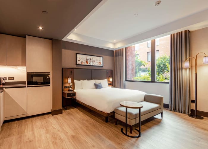 The Accessible Rooms at The Fellows House, Curio Collection by Hilton in Cambridge are spacious and comfortable rooms featuring a king-sized bed, floor to ceiling windows, a neutral colour palette.