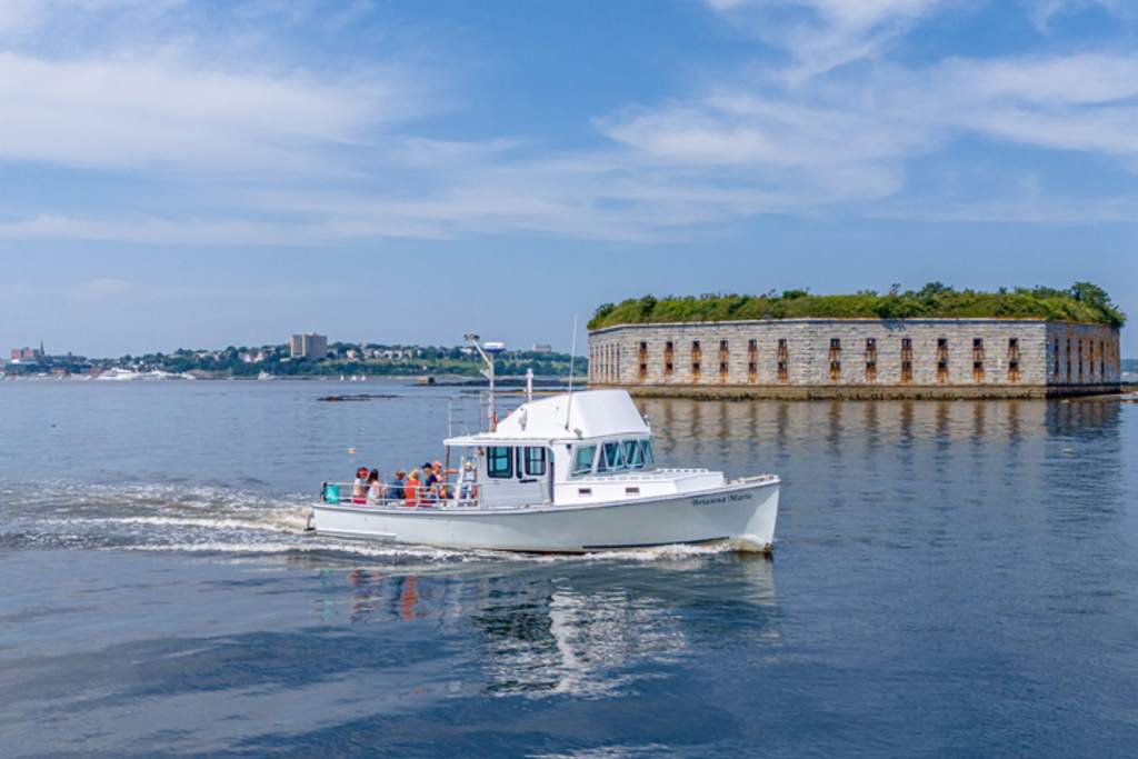 Boat Passing Fort Gorges. Photo Credit: Peter G. Morneau