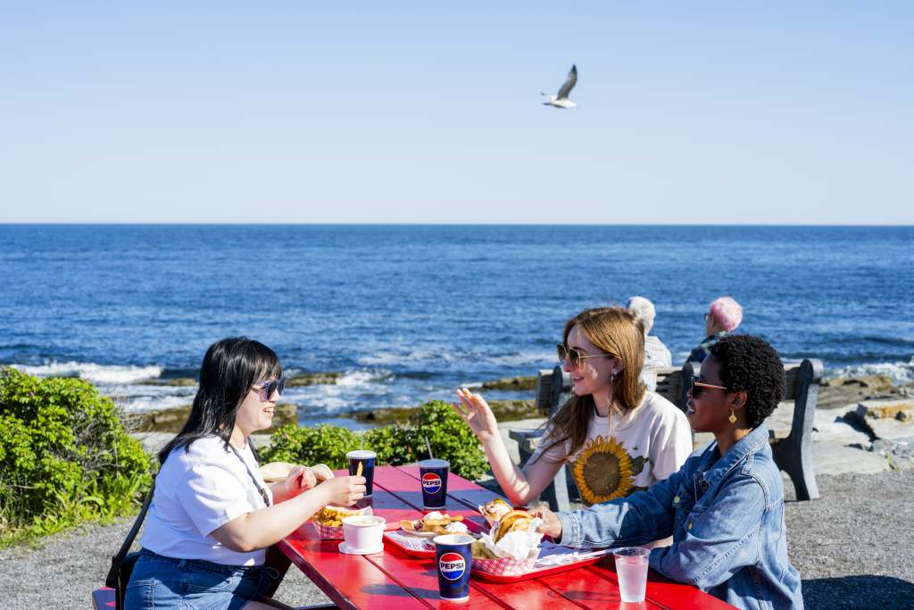 Friends Having Lunch at The Lobster Shack. Photo Credit: Capshore