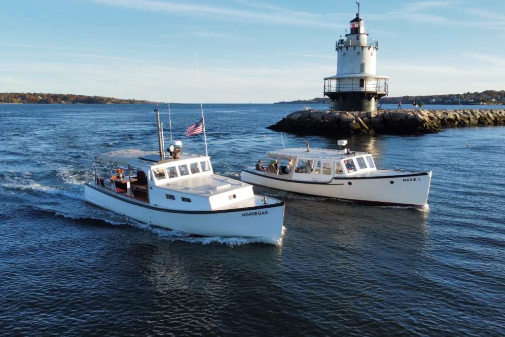 Boats Cruising Past Lighthouse. Photo Credit: Casco Bay Custom Charters