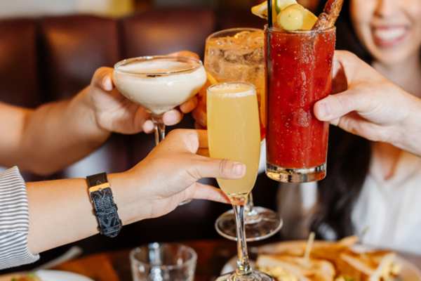 Friends raising their glasses in a cheers