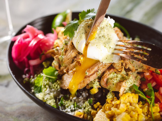 A colorful mouth-watering salad with a soft-boiled egg