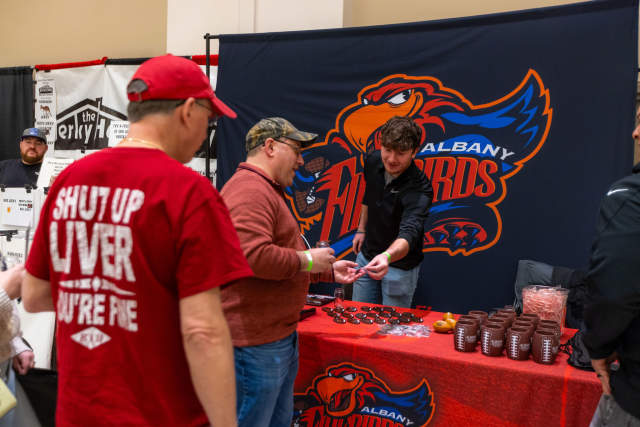 men at booth during beer summit