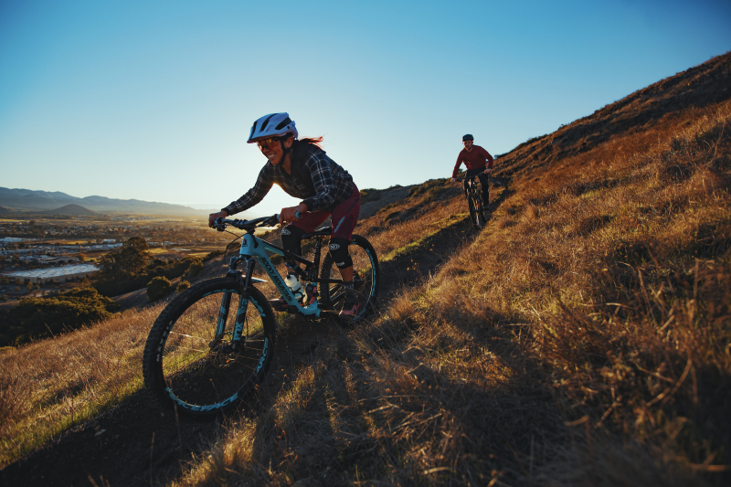 two friends mountain biking in slo cal