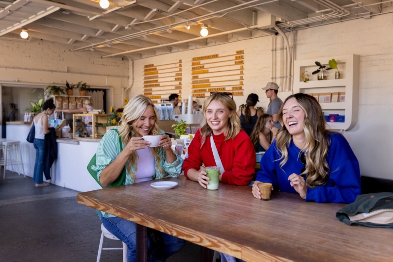 Group of three women enjoying coffee at Field Day in San Luis Obispo