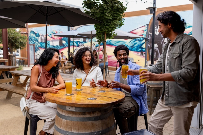 Friends enjoying a beer at Ancient Owl in Atascadero