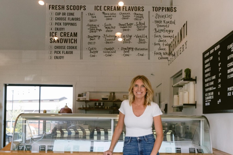 Alexis Negranti creamery owner in front of ice cream