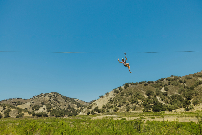 person on zipline at Vista Lago Adventure Park