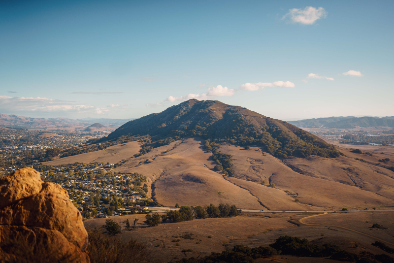 Green and brown Cerro San Luis Obispo (Madonna Mountain) from a distance