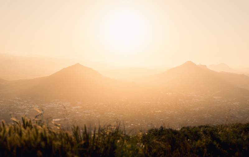 Sun shining between two mountain tops